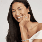 engagement rings sale featured image woman smiling wearing engagement ring